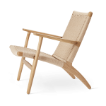 CH25 Lounge Chair side view in oiled oak with natural papercord seat