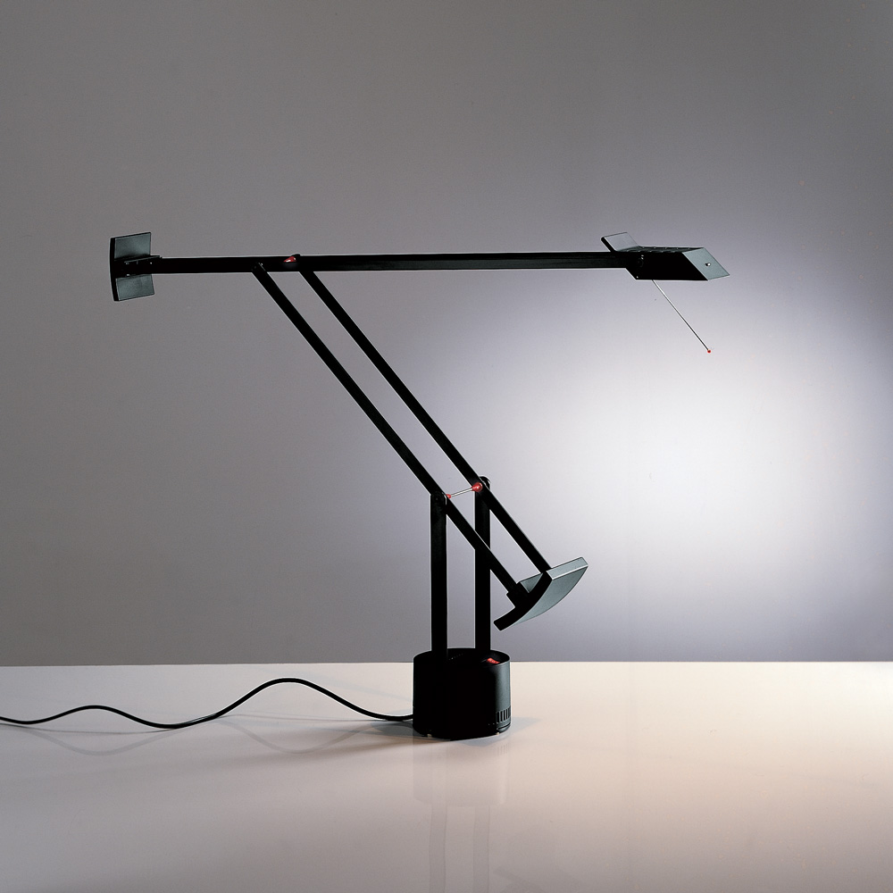 Artemide Tizio table lamp in black, articulated counterbalanced arms with small pivoting head and wedge counterweights on a cylindrical base, side view.