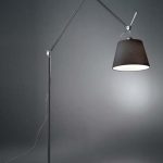 Artemide Tolomeo Mega Floor lamp in polished aluminum with large black fabric drum shade, articulated arm extended on a circular floor base, full length view.